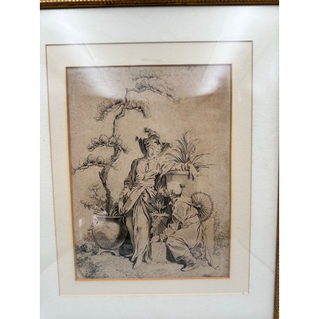 Antique 18th-century French engraving after François Boucher (1703–1770), presented in an ornate black and gilt frame. The...
