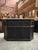 This old oak bar counter has been completely restored. Its black patinated front features carved arch motifs and its top...
