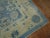 An early 20th century oversize size one of a kind Chinese rug in various predominant light blues and creams. The wool and...