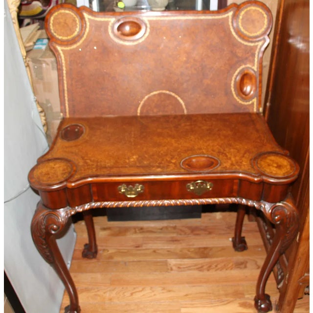 Crafted with an eye for classic design, this Chippendale Style Mahogany Game Table is a true antique that exudes timeless...