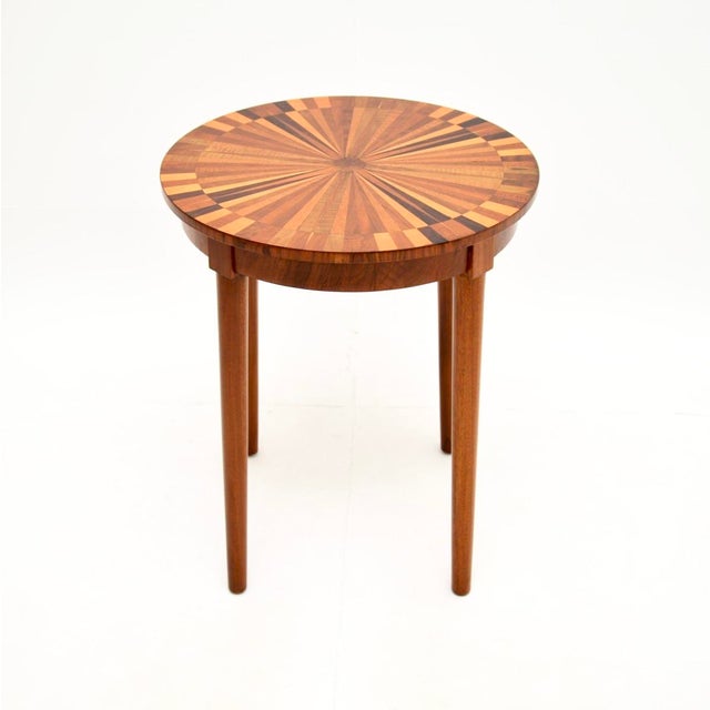 A stunning vintage French inlaid starburst side table, dating from around the 1950’s. This is of lovely quality and has an...
