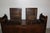 Oak storage bench with a carved front, opening with four drop-leaf doors: two under the seat and two on the sides for...
