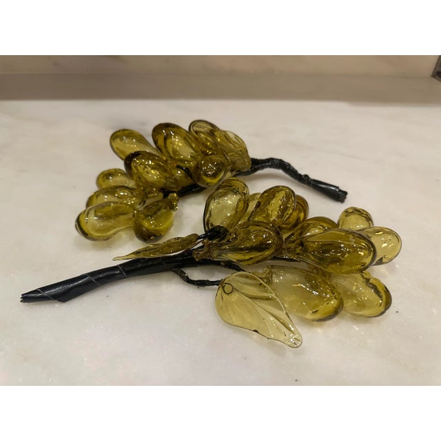 Cluster of yellow blown glass grapes. Two clusters available for purchase and sold separately. Slight variations in shape...