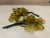 Cluster of yellow blown glass grapes. Two clusters available for purchase and sold separately. Slight variations in shape...