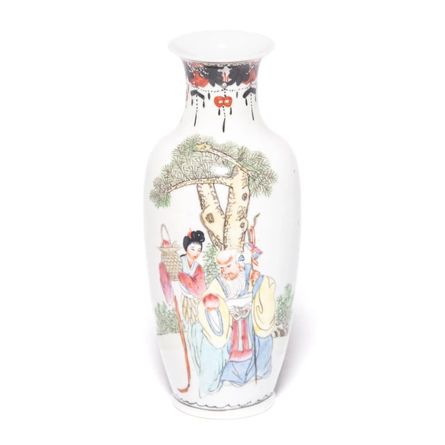 Unusual for the petite size, this pair of vases is a beautiful example of famille rose enamelware, also known as fencai...