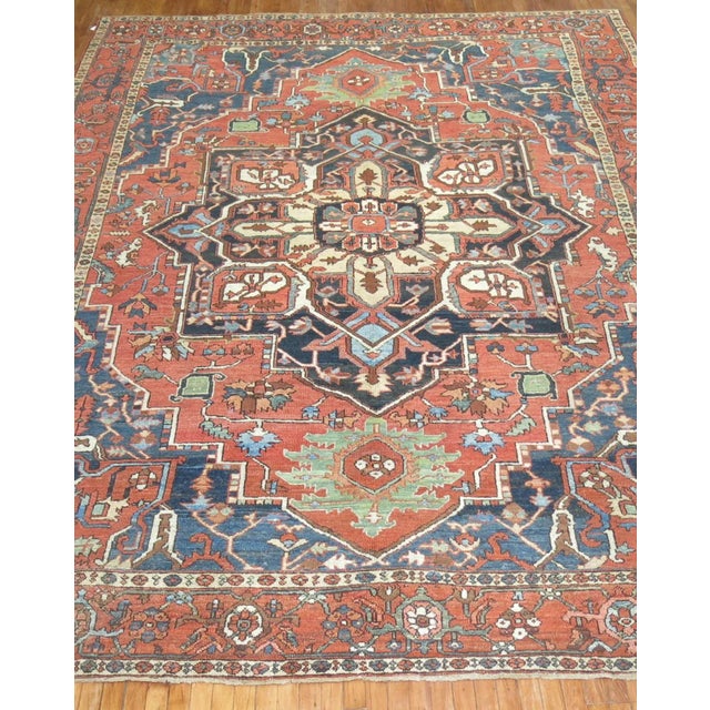 An early 20th Century rare size colorful Persian Heriz rug with a medallion and border design . these rarely come in 10 x...