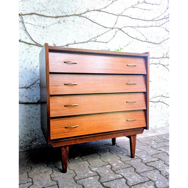 Stunning brass handles and beveled fronts give it a touch of elegance.
