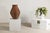 A Thai ribbed vintage pottery vase with burnished surface from the Prem collection with tapering lines wrapped around the...
