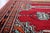 An exceptional Vintage Uzbek Bukhara Multi-Niche Prayer Runner hand-knotted by skilled weavers in Uzbekistan during the...