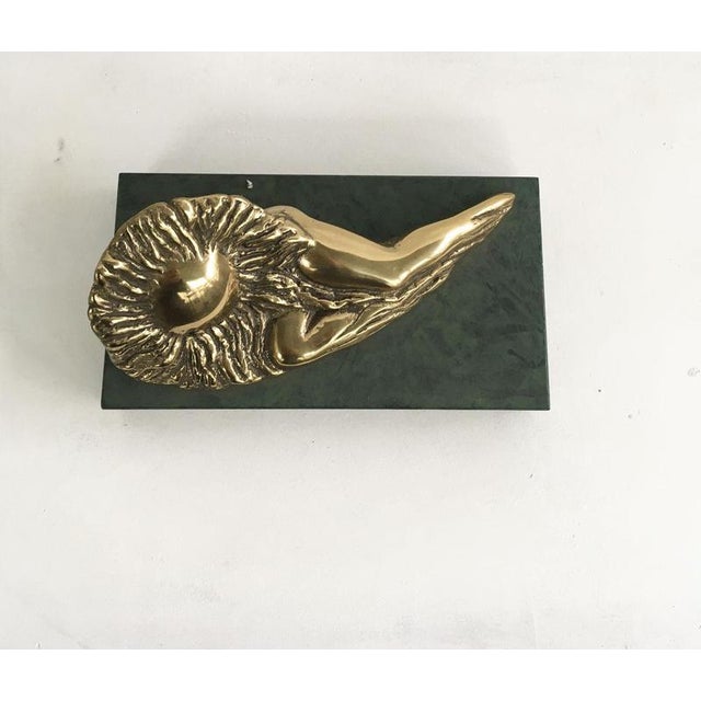 This is an engaging bronze sculpture create by the Italian artist Patrizia Guerresi, in the 1986. The piece is a multiple...