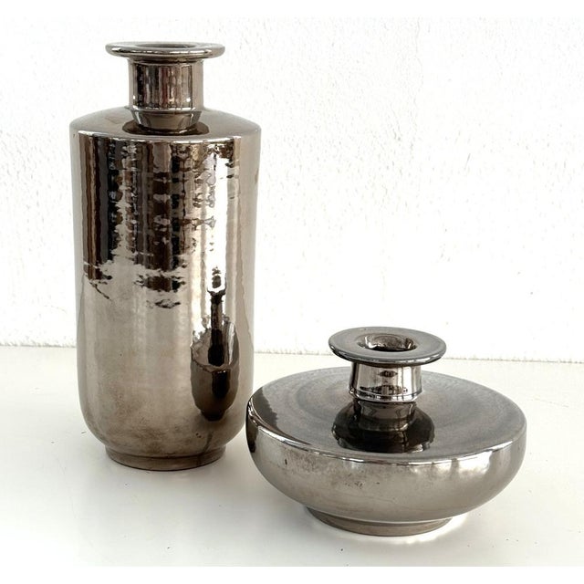 Gorgeous and rare Bitossi vase made of ceramic with beautiful shiny metallic platinum glaze with a disc shaped lip,...