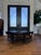Hollywood Regency Attributed to Hickory Chair Company Flame Mahogany Round Coffee Table With Brass Sabots For Sale - Image 3 of 12
