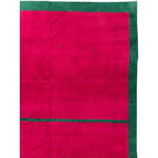This Mid-20th century Turkish Anatolian minimalist carpet presents a striking composition defined by saturated color,...