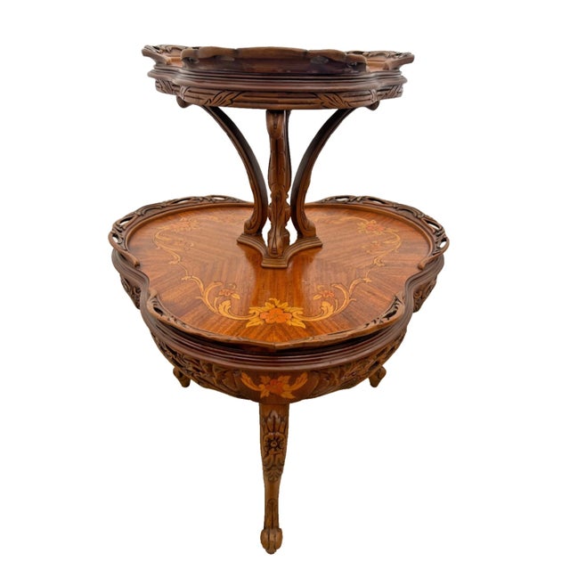 Beautiful Antique French Art Nouveau two tier etagere or jardiniere table, crafted in richly figured mahogany with...