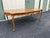 A French country style extension dining table attributed to Century Furniture. Made of fruitwood with burlwood banding,...