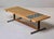 This low rectangular cocktail table features a top combining two surface treatments: a large craquelure field in gold and...