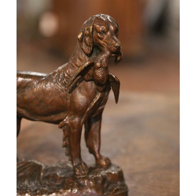 Decorate a man's desk or a shelf with this antique dog and bird sculpture. Created in France circa 1870, and standing on...