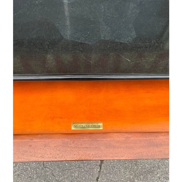 Elegant and substantial, this four-drawer commode by Maitland-Smith showcases the refined craftsmanship and luxurious...