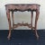 Antique carved walnut occasional accent table. It is made of carved walnut wood and features intricate carvings and...