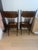 An exceptionally striking pair of antique Victorian Eastlake-style dining chairs featuring intricate carved lion motifs,...