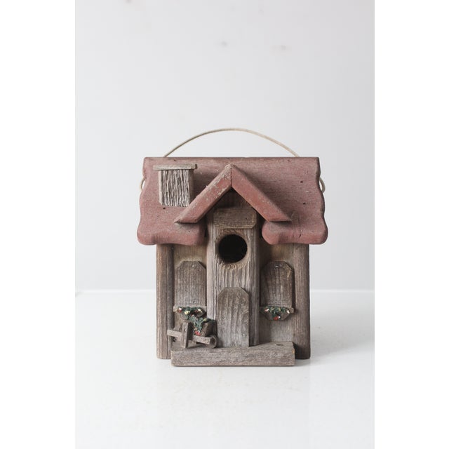This is a vintage birdhouse by artist Brian Marshall circa 1990s. The rustic wooden house features a red roof top, sweet...