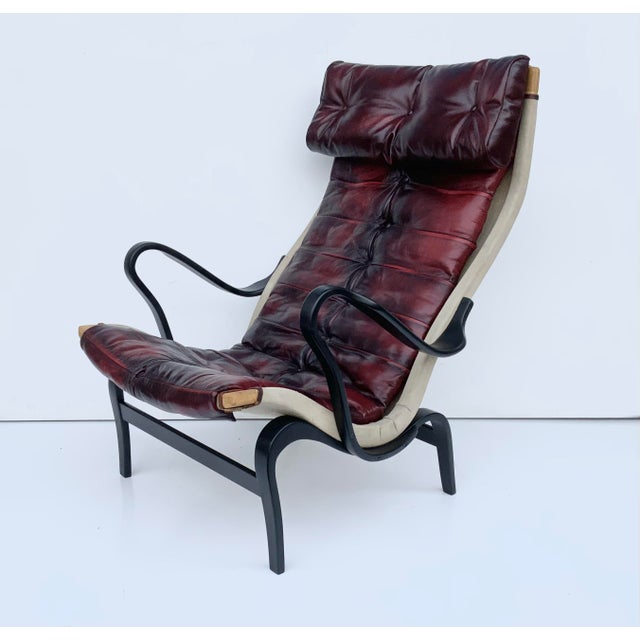 Bruno Mathsson Vintage Bolt 69 Chair in Oxblood Leather by Bruno Mathsson for Dux, 1960s For Sale - Image 4 of 16