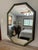 A striking large 39" octagon shaped wall accent mirror made in the USA by Edward Art Products, circa 1970s-1980s. Original...
