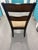 Wooden dining chair featuring a cushioned upholstered seat. • Rich wood finish with a ladder back design • Comfortable...