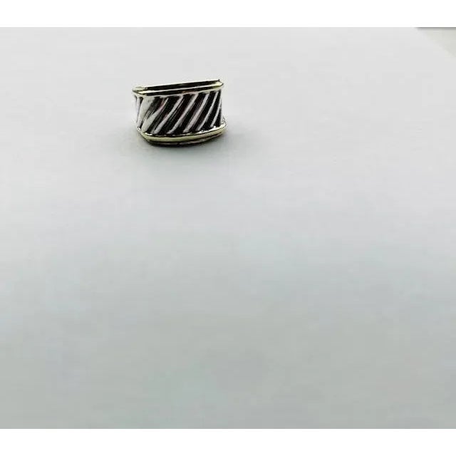 A vintage David Yurman Sculpted Cable ring, size 8, featuring sterling silver with 14kt yellow gold borders - a timeless...