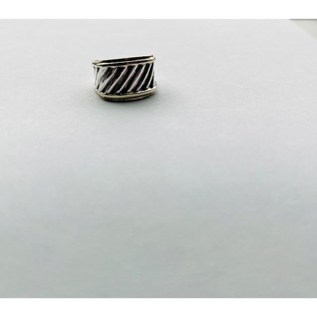 A vintage David Yurman Sculpted Cable ring, size 8, featuring sterling silver with 14kt yellow gold borders — a timeless...