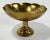 Vintage heavy brass engraved compote bowl on a pedestal stand. Engraving inside bowl features flower bouquets. Patina.