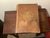 An antique wood stand with a thick top, a lower shelf and turned legs, sized to hold a large dictionary. It comes with a...