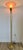 Vintage Hollywood Regency/Art Deco brass torche/floor lamp. The shade is pink glass with scalloped edges. It is a tap to...