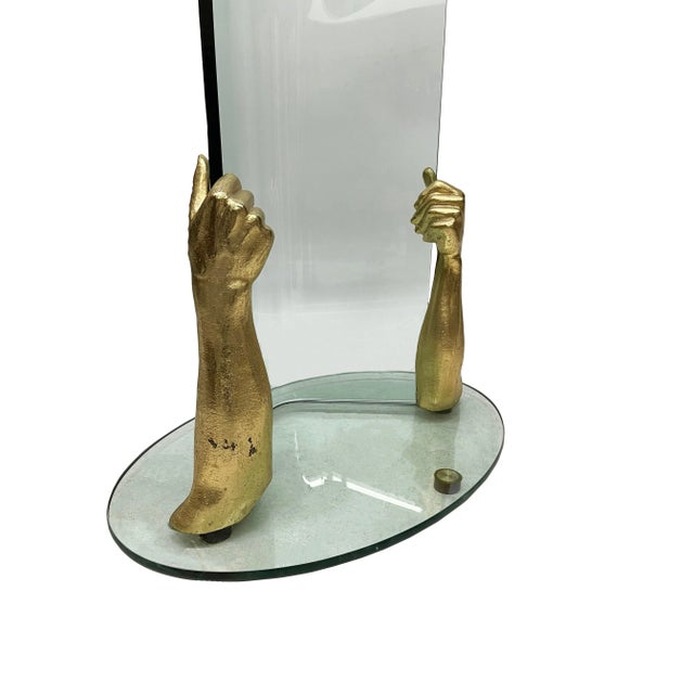 This is a glass with bronze standing coat rack. It is a modern, thick glass coat rack in the shape of a tree, with curved...