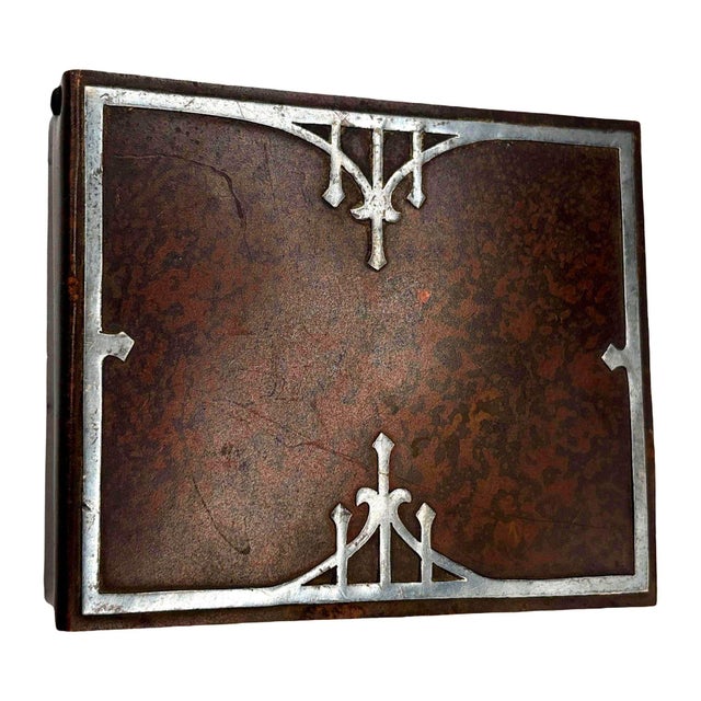 Arts & Crafts/Mission era humidor by the Heintz Art Metal Shop features a heavy, dark bronze body finished with a rich,...