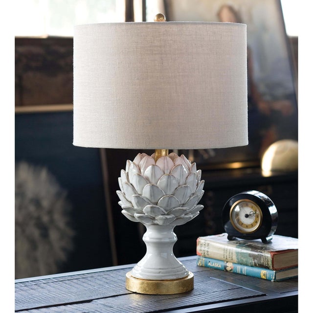 The Leafy Artichoke ceramic table lamp is a beautifully crafted, refined fixture. The soft gold base serves as a...