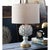 The Leafy Artichoke ceramic table lamp is a beautifully crafted, refined fixture. The soft gold base serves as a...