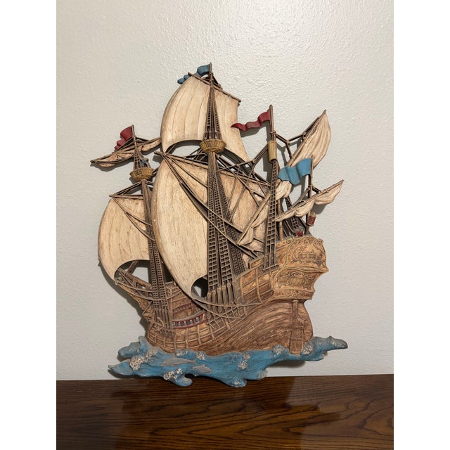 Striking vintage nautical wall sculpture by Syroco Inc., Made in USA, featuring an intricately detailed sailing ship with...
