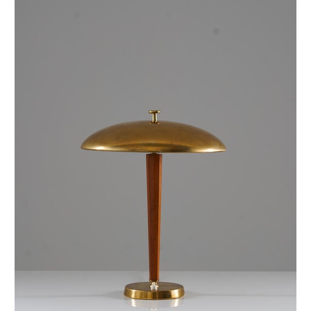 Beautiful table lamp manufactured by nordiska kompaniet (nk), circa 1930. This lamp is made of brass and oak with a shade...