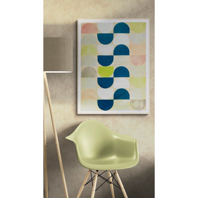 This whimsical piece features a repeating pattern of half circle shapes in various colors with a dominating center...
