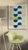 This whimsical piece features a repeating pattern of half circle shapes in various colors with a dominating center...