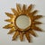 Beautiful gilded sunburst mirror from the 1960s This striking mirror is designed in the shape of a stylized sun. The round...