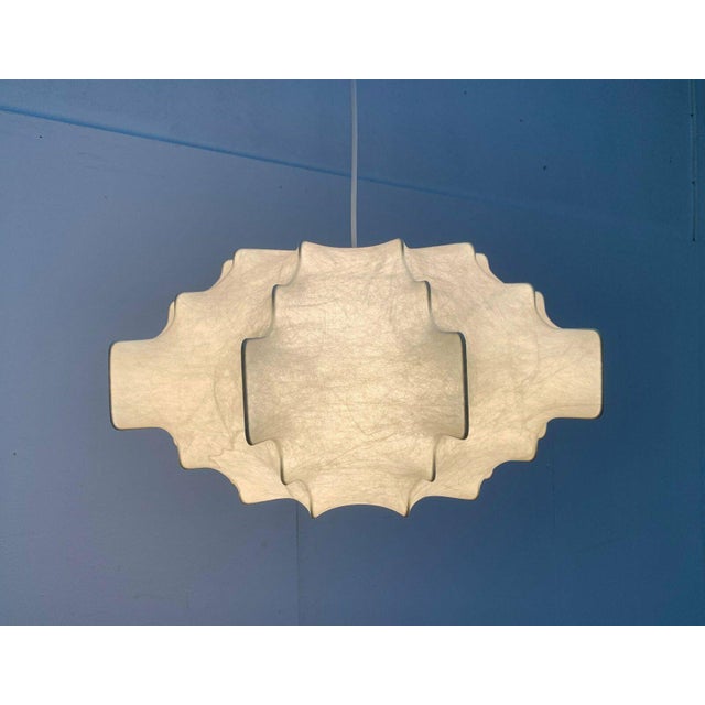 Rare mid-century Cocoon pendant light by Goldkant Leuchten. The flat Cocoon shade provides diffused, atmospheric light. At...