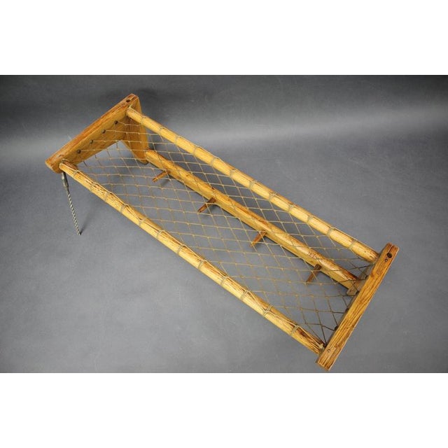Elegant Mid-Century wall-mounted coat rack produced in Czechoslovakia during the 1950s. The piece combines a practical...