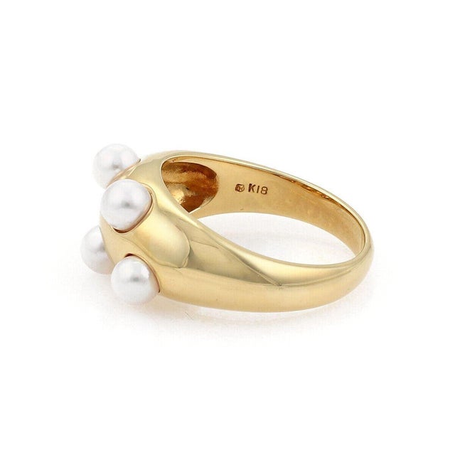 The Mikimoto 5 Akoya Pearls 18k Yellow Gold Dome Band Ring is a luxurious piece of vintage jewelry that exudes elegance...