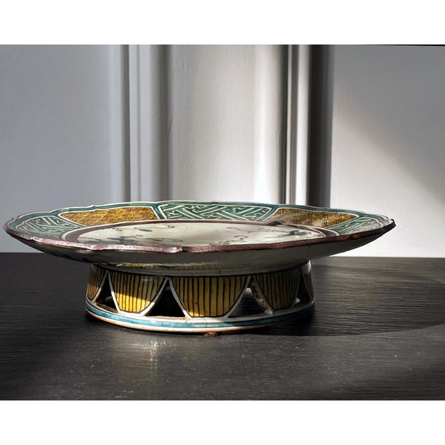 A Japanese glazed ceramic footed dish made in the Ko-Kutani type of Edo period but likely during Kutani revival in the...