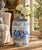 A classic blue and white porcelain garden stool, decorated with traditional Chinese motifs and stylized floral elements....