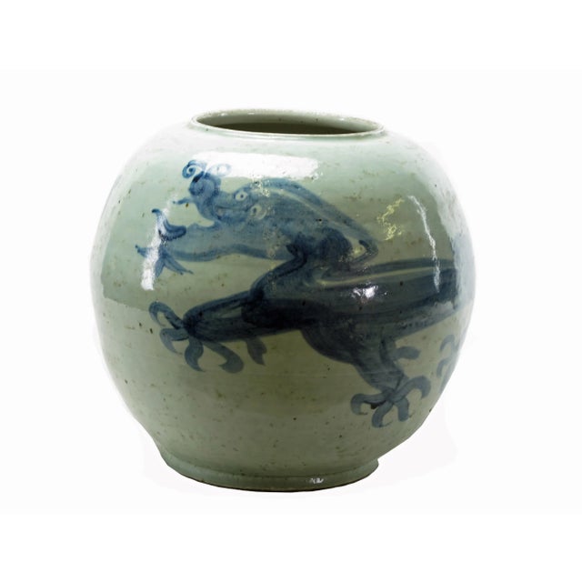 This large powerful dragon vase is hand-made and hand-painted with traditional blue and white motif by ceramist from...