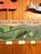 Vintage STICKS by Sarah Grant hand-painted folk art wall coat/peg rack, dated 1997. This whimsical 36-inch wooden rack...