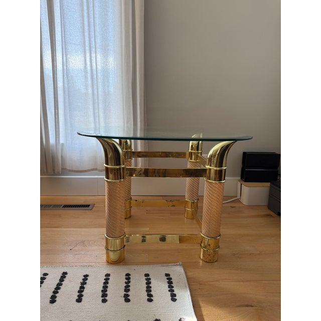 Transform your living space with this stunning end table, where refined materials meet artful design. The table features a...